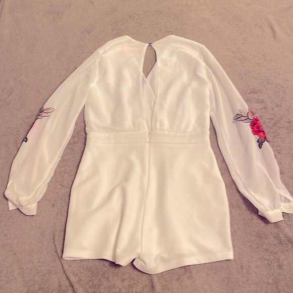 White Romper w/ long Sheer sleeves. Open back. Beautiful rose design - Picture 2 of 2